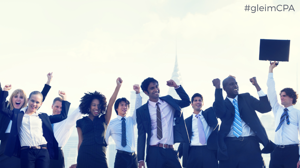 diverse people in suits celebrating