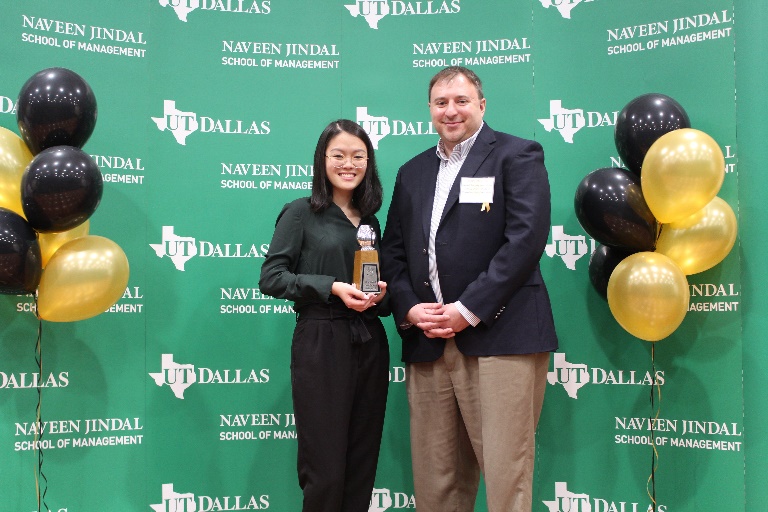 Angie Wong receiving an OWLIE with Professor Joseph Mauriello