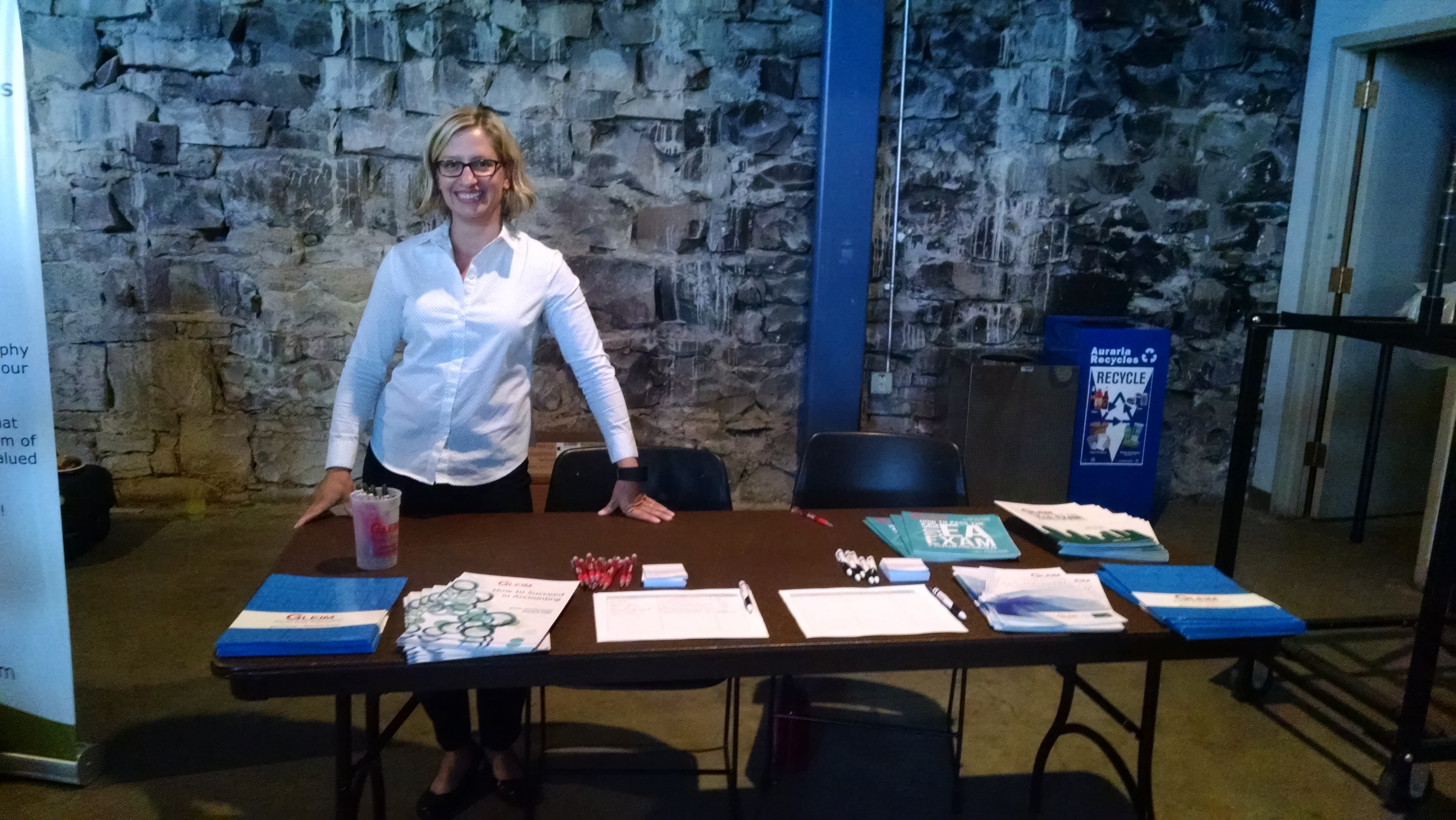 Casie Cook prepares a presentation table.