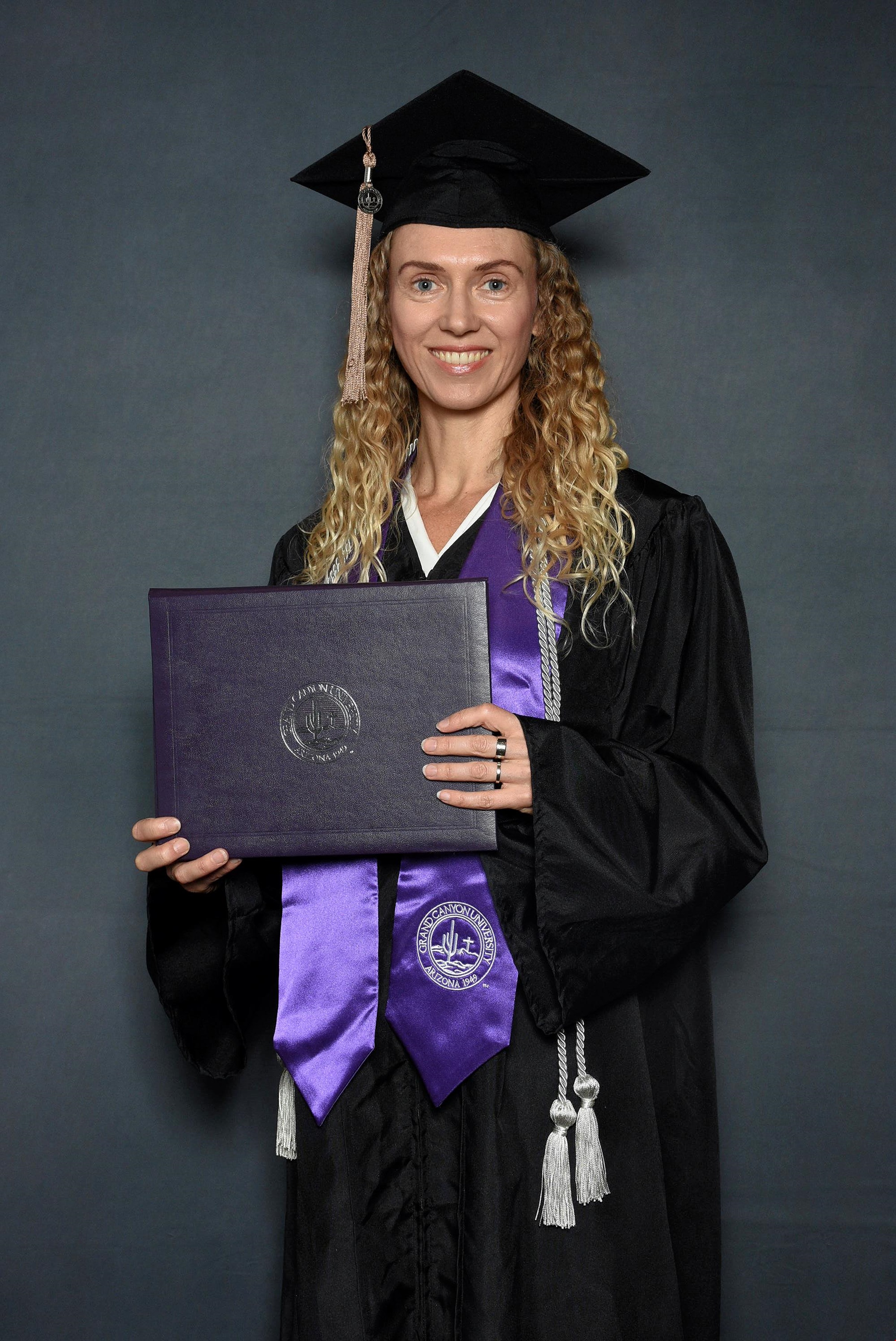 Lauren Edge in her GCU graduation cap and gown after earning her Bachelor's in accounting